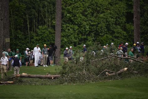 Storms bring down trees at Masters, play halted in 2nd round